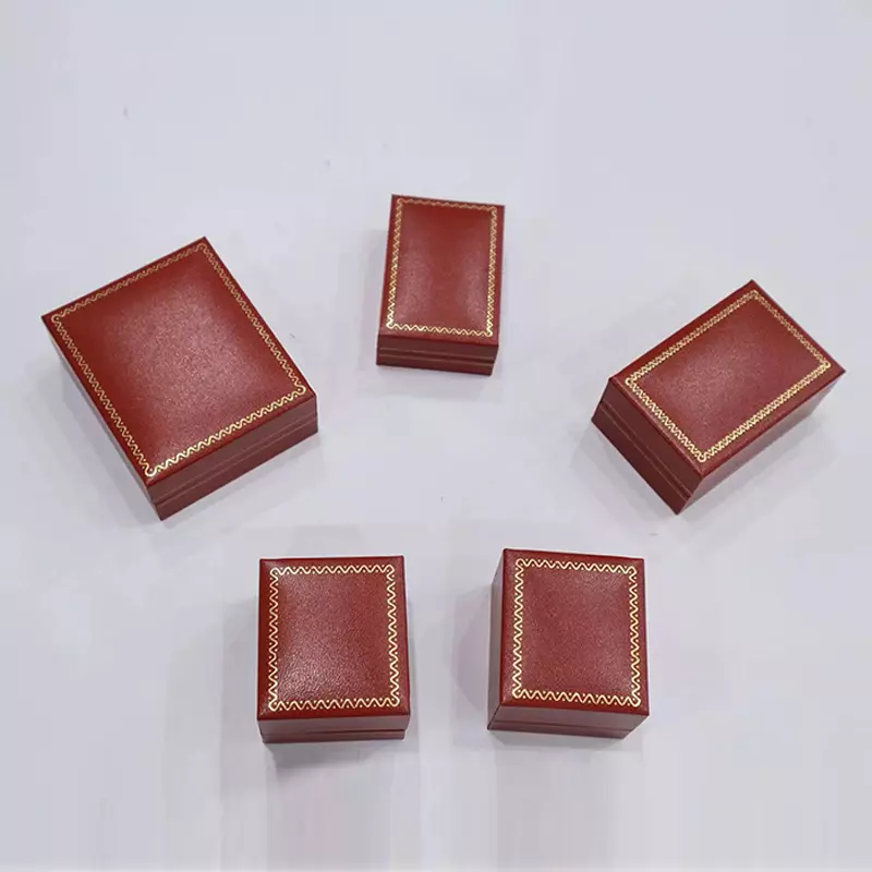 Certo-Angular reto-Caixa de borda com curvas vermelhas e padrões de ouro
